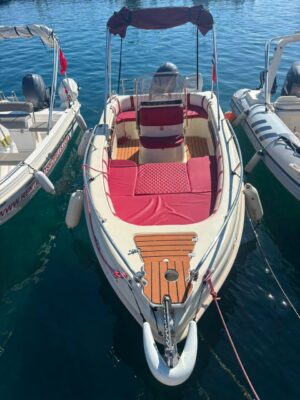 Wind Boat 5.30m bow and red seating view in Skopelos marina