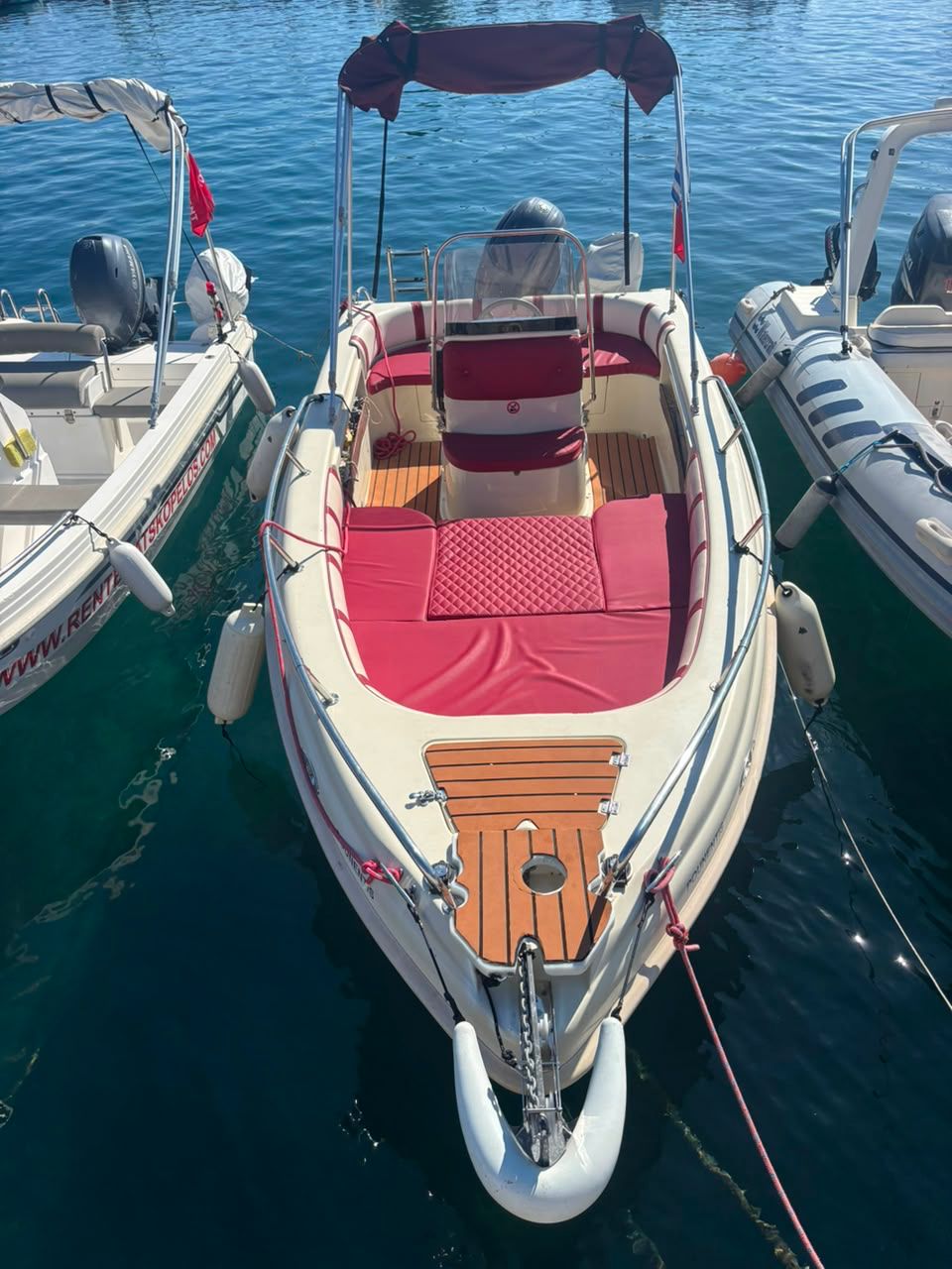 Wind Boat 5.30m bow and red seating view in Skopelos marina