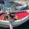 Wind Boat 5.30m side view with red seats in Skopelos marina